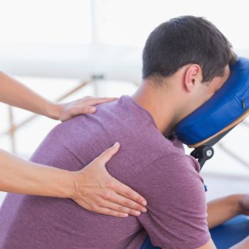 Man having back massage in medical office